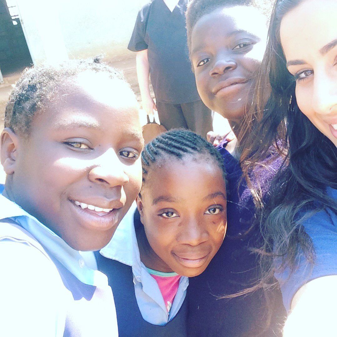 A group of children are posing for a picture together