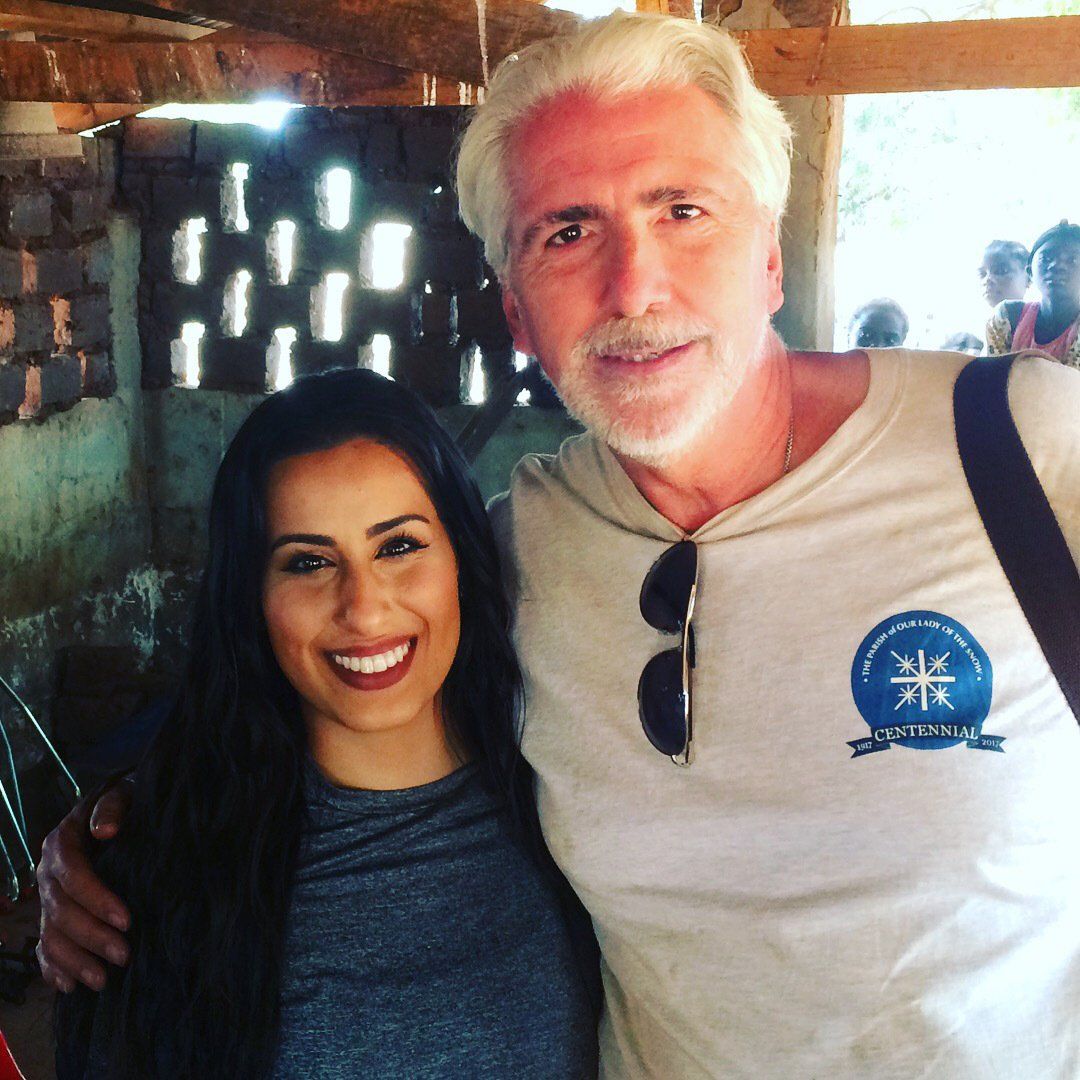 A man and a woman are posing for a picture together