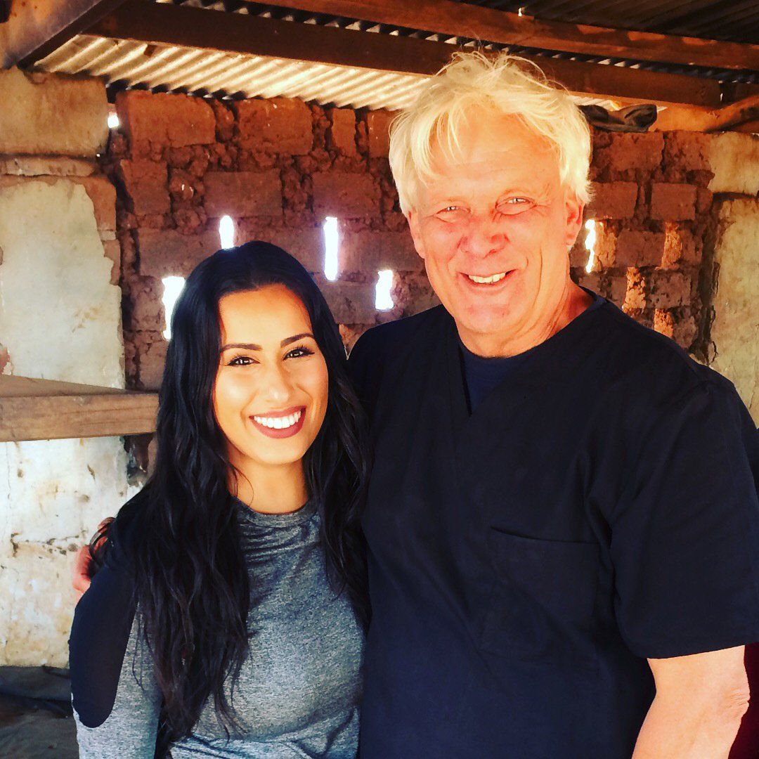 A man and a woman are posing for a picture together