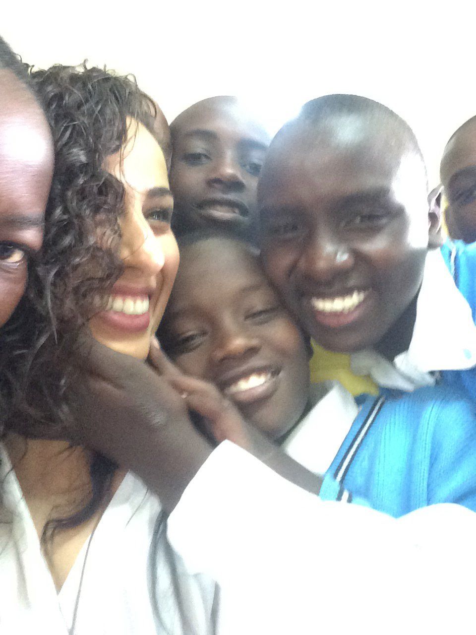 A group of people are posing for a picture and smiling