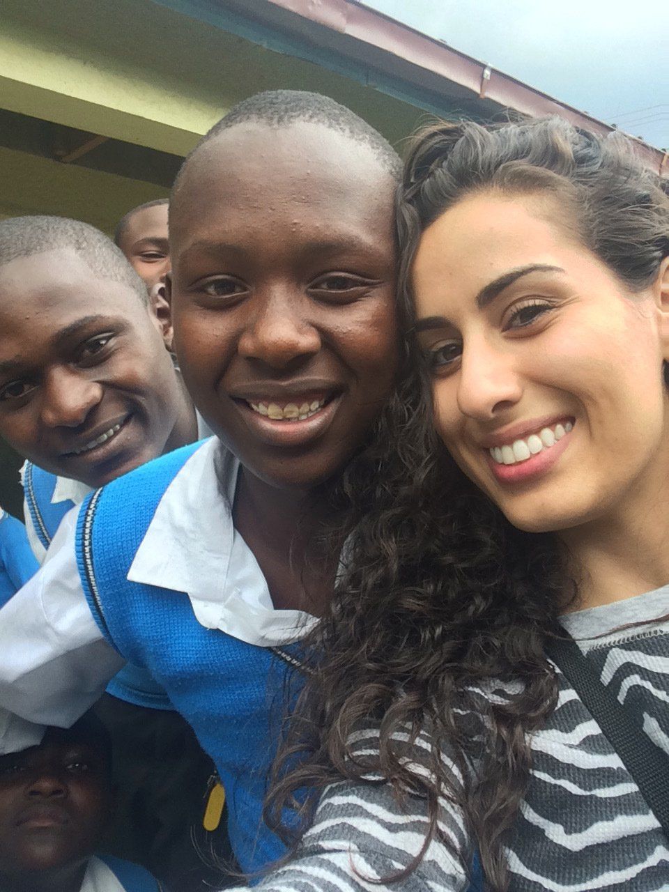 A group of people are posing for a picture and smiling