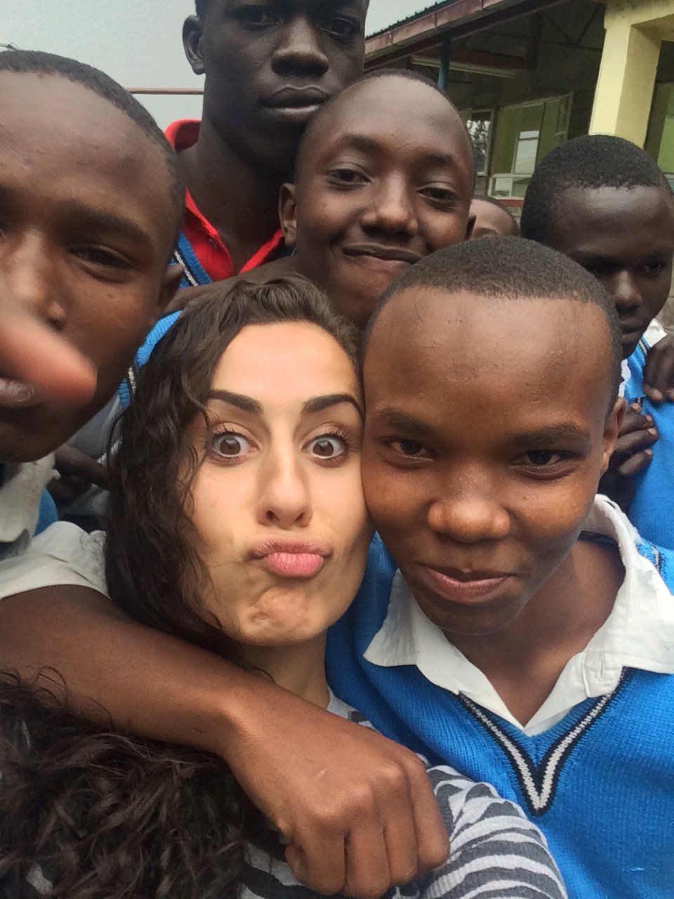 A group of young people are posing for a picture