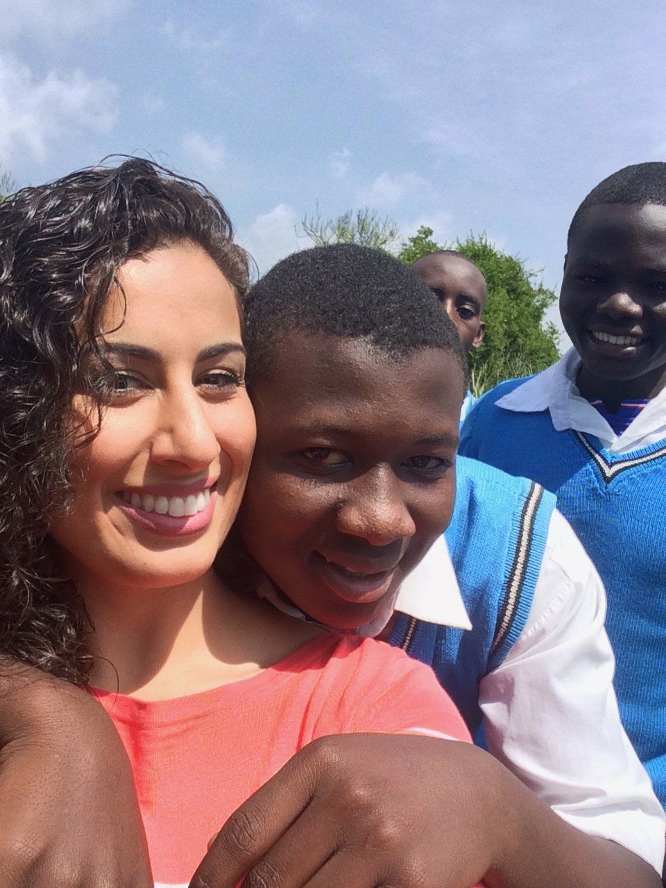A group of people are posing for a picture and smiling