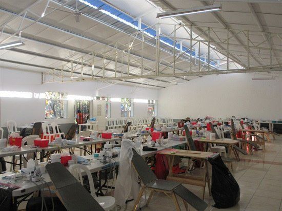 A large room with tables and chairs in it