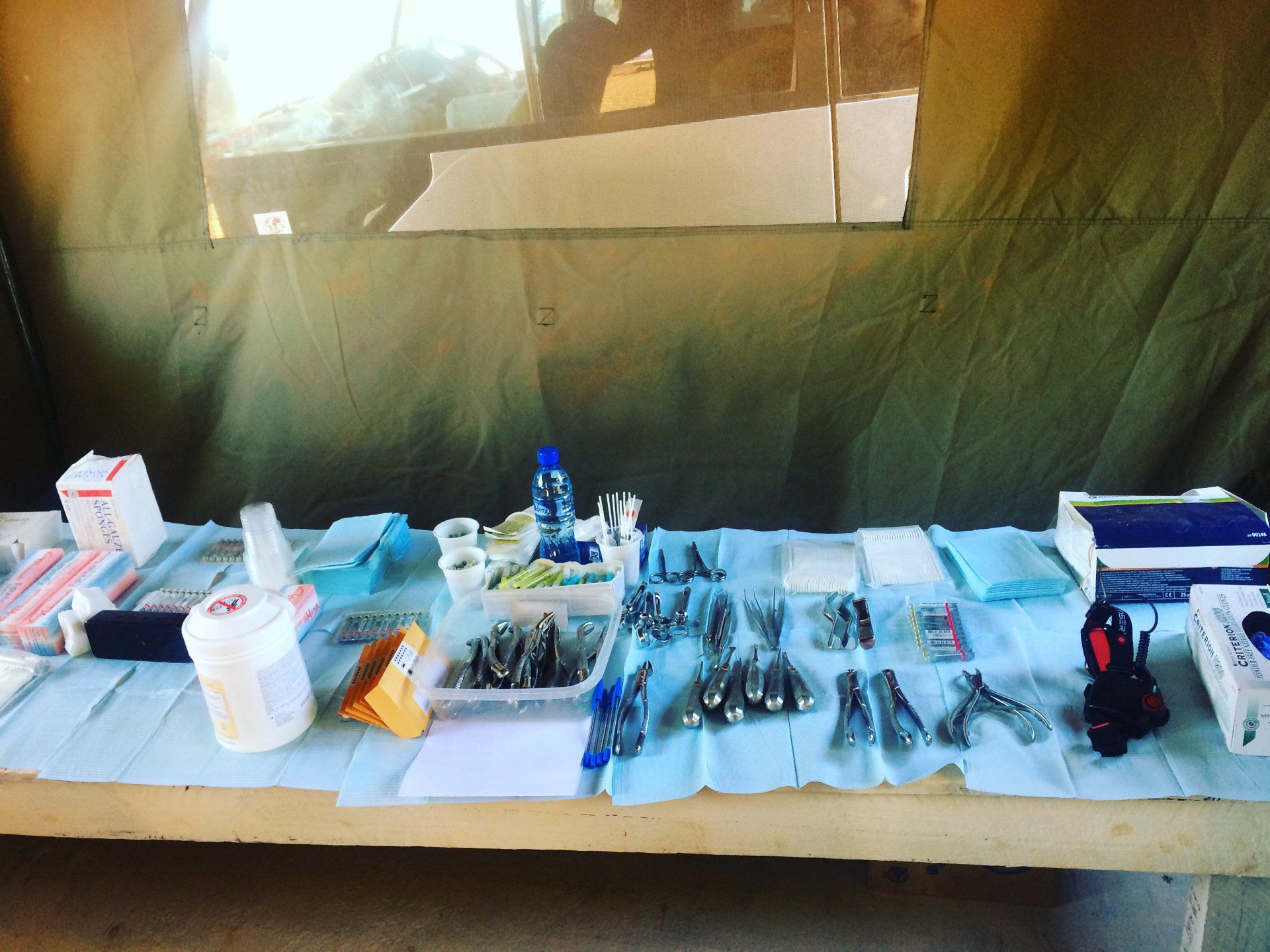 A table with a lot of medical supplies on it