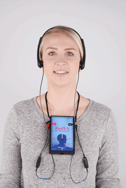 A woman wearing headphones and a cell phone around her neck.