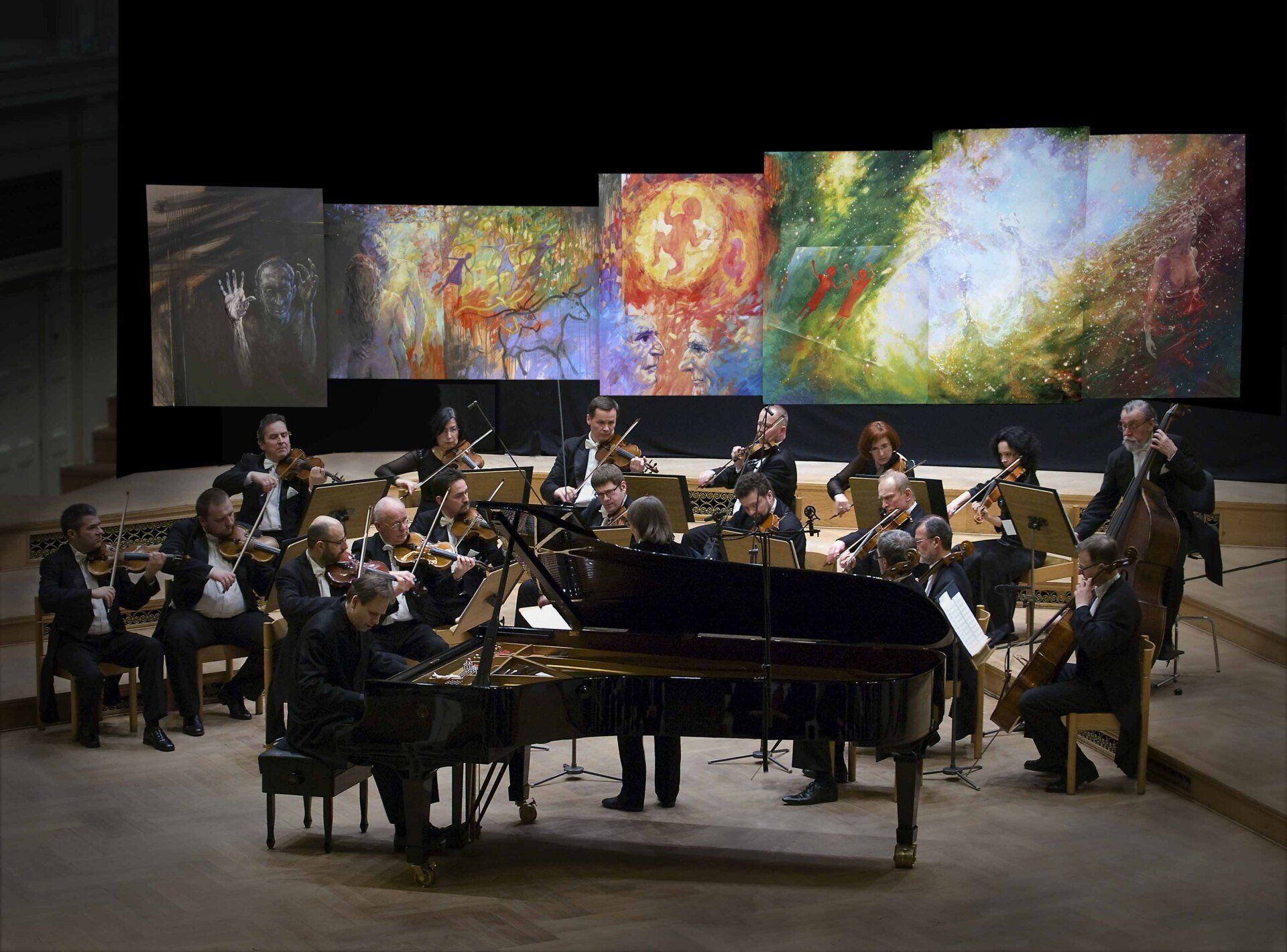 Amadeus Orchestra of Polish Radio in front of Mariusz Kaldowski painting to Mussorgsky's Pictures at an Exhibition
