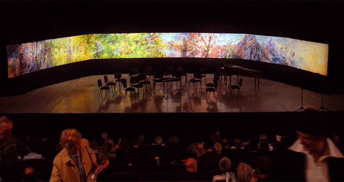 Four stages of life painting on stage before Vivaldi concert