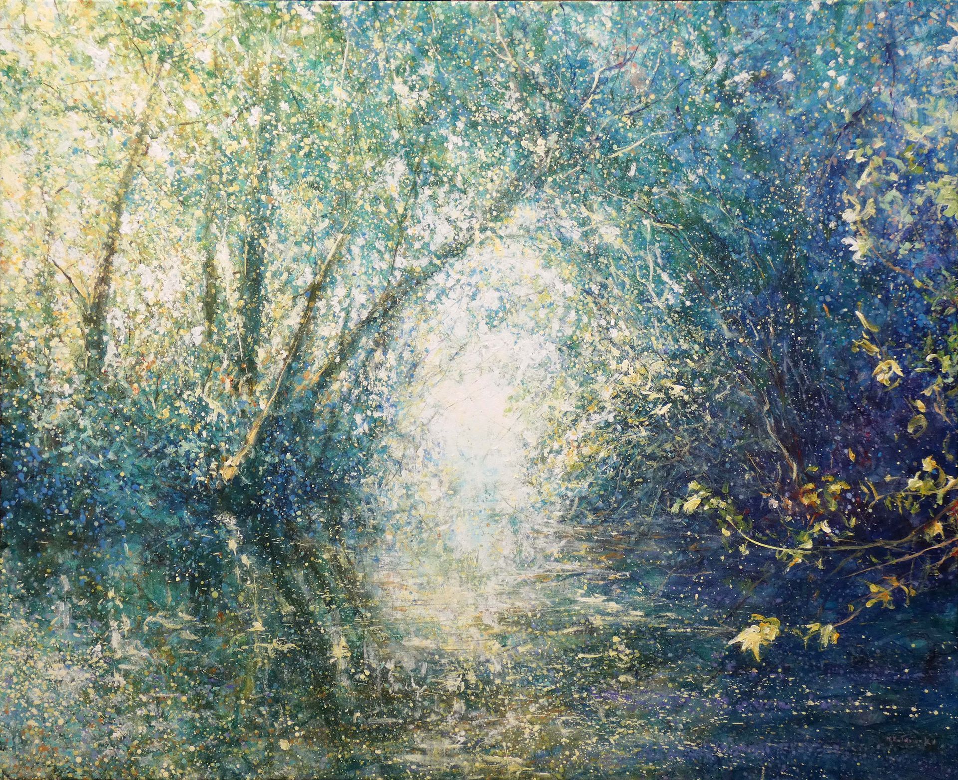Sunlight filtering through trees, reflected in a shimmering woodland river.