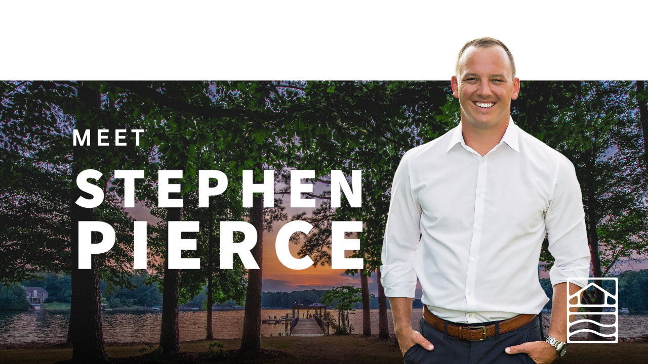 A man in a white shirt is standing in front of trees.