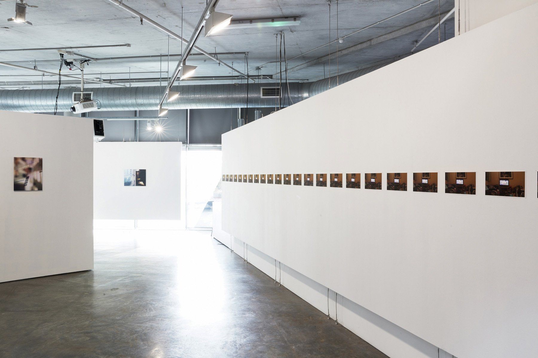  Installation view. Live streaming, Prince Edward, 12/11/2019, 23:35:05-6. 25 frames per second, 1920x1080. 2019. 14.06x25cm. 25 Archival pigment prints. Photograph by Zan Wimberley 