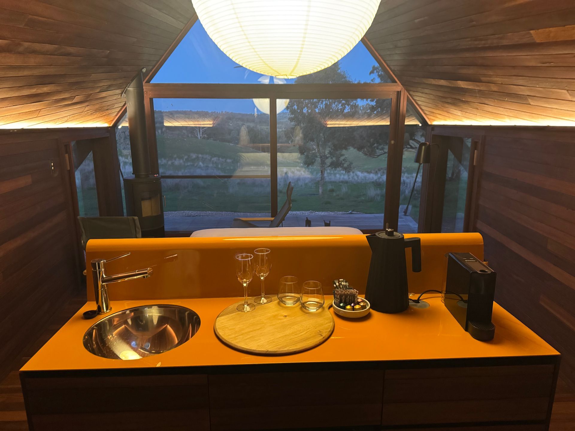 Interior of a cabin with a sink, countertop, and a large window overlooking the outdoors — SJD Electrical Contracting in Parkes, NSW
