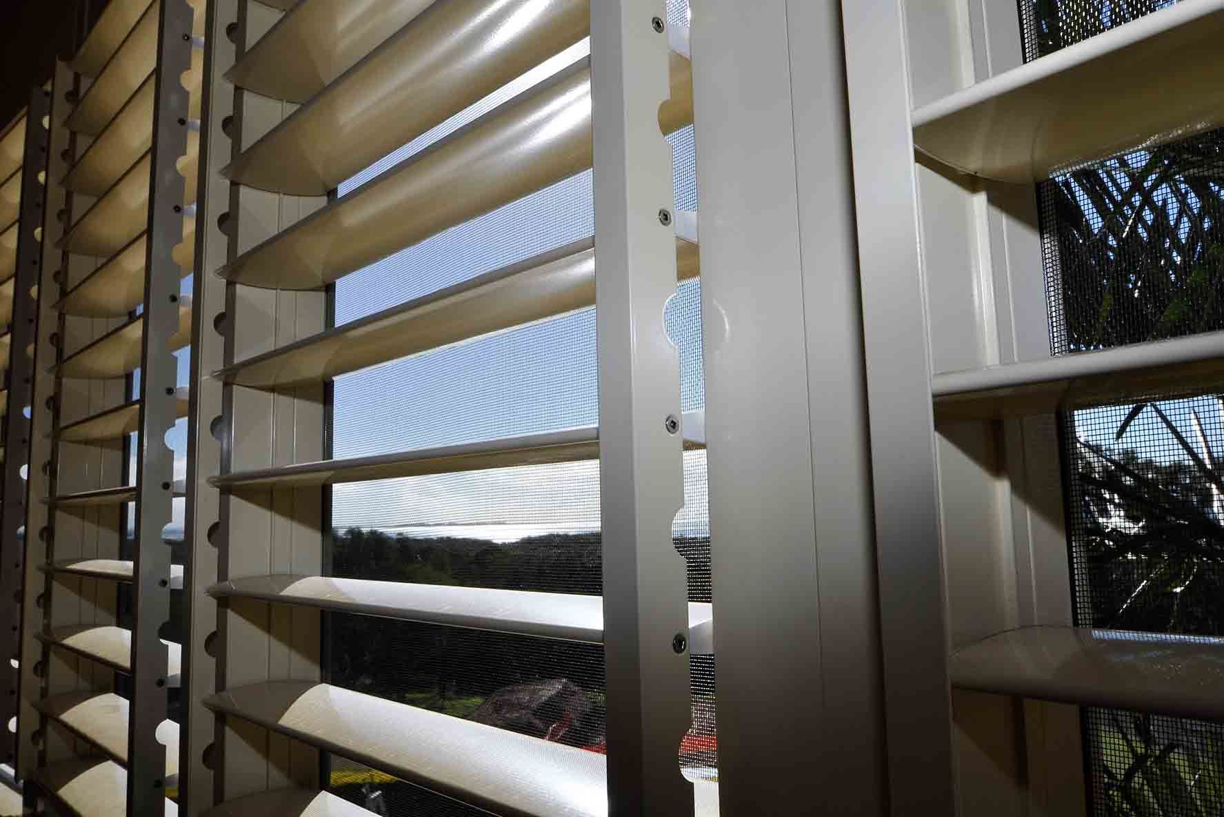A Close Up Of A Window With Shutters On It — Balcony Shutters Australia In Brisbane, QLD