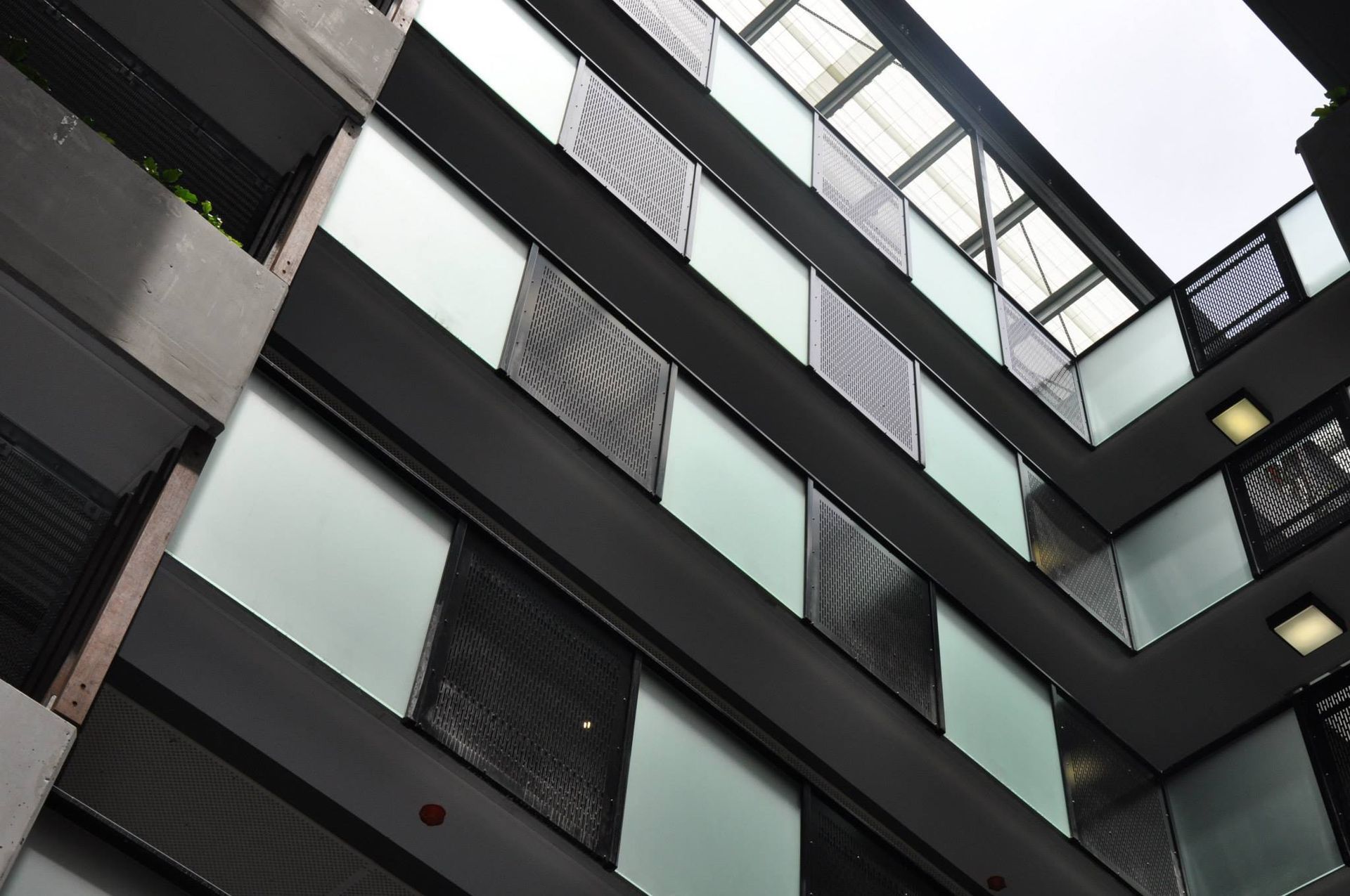 Multi-story Building Interior With Glass and Metal Balconies