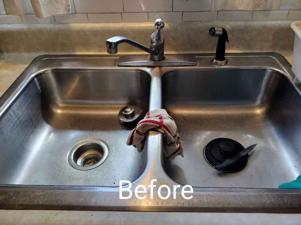 Cluttered double kitchen sink with dishes and cleaning items, labeled “Before”