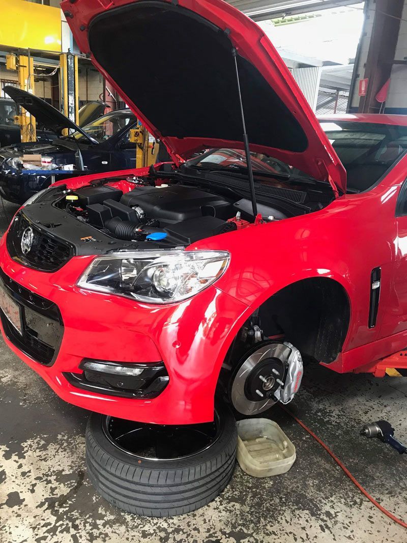 Red Car With Brake Upgrade — Torque Masters Auto Repairs Centre In Portsmith QLD