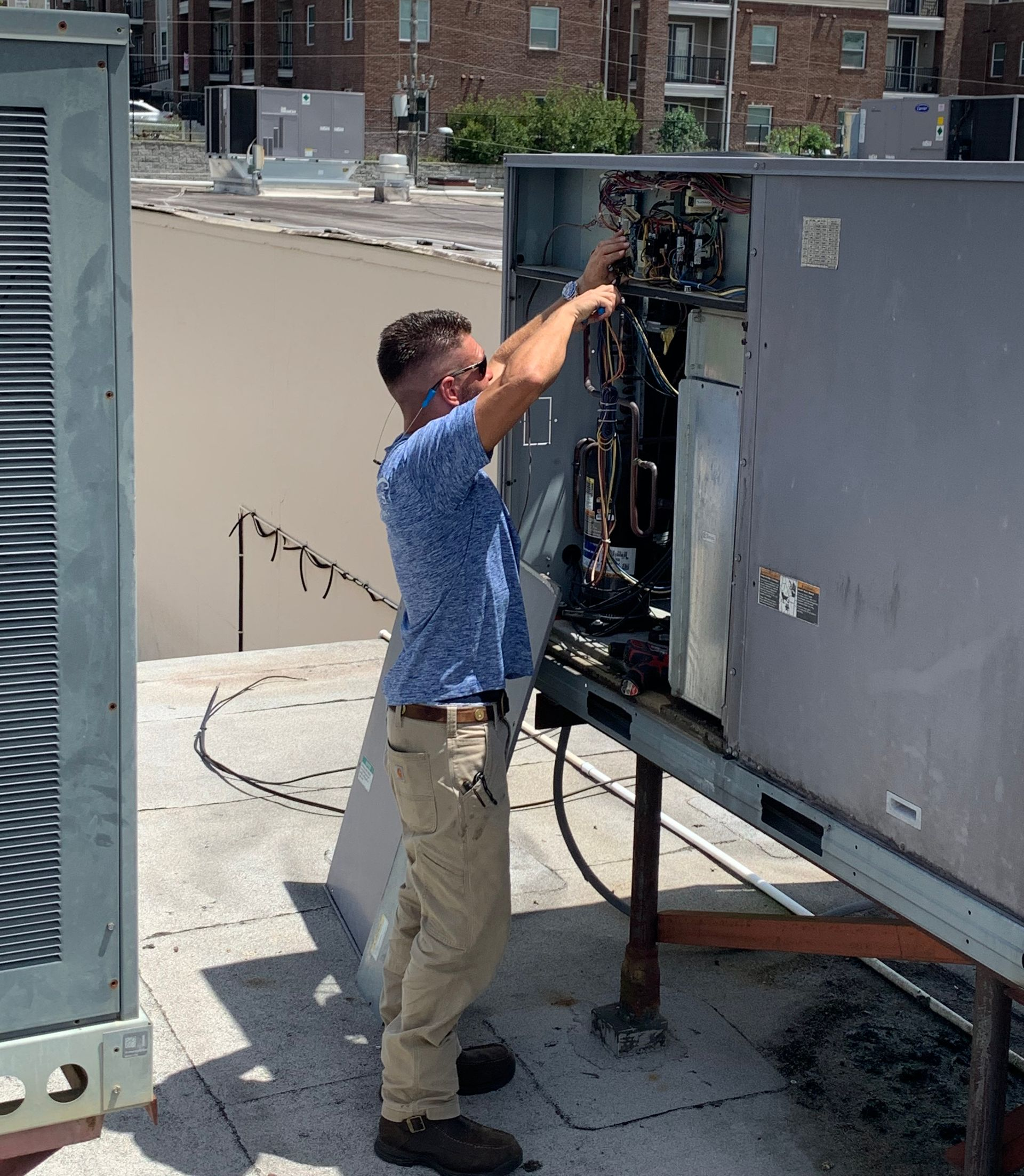 Workers install air conditioning - Tallahassee, FL - Todd King's Heating and Cooling