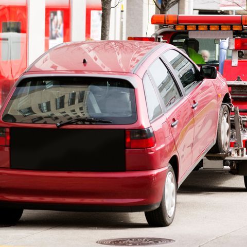 A Red Car Is Being Towed By A Tow Truck — APPS Mechanical Port Macquarie In Port Macquarie, NSW