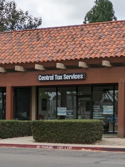 Storefront for Central Tax Services with brown tile roof and glass entrance