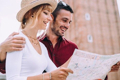 Couple exploring Venice with a map