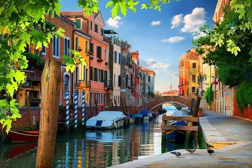 Colorful houses and boats in Venice canal