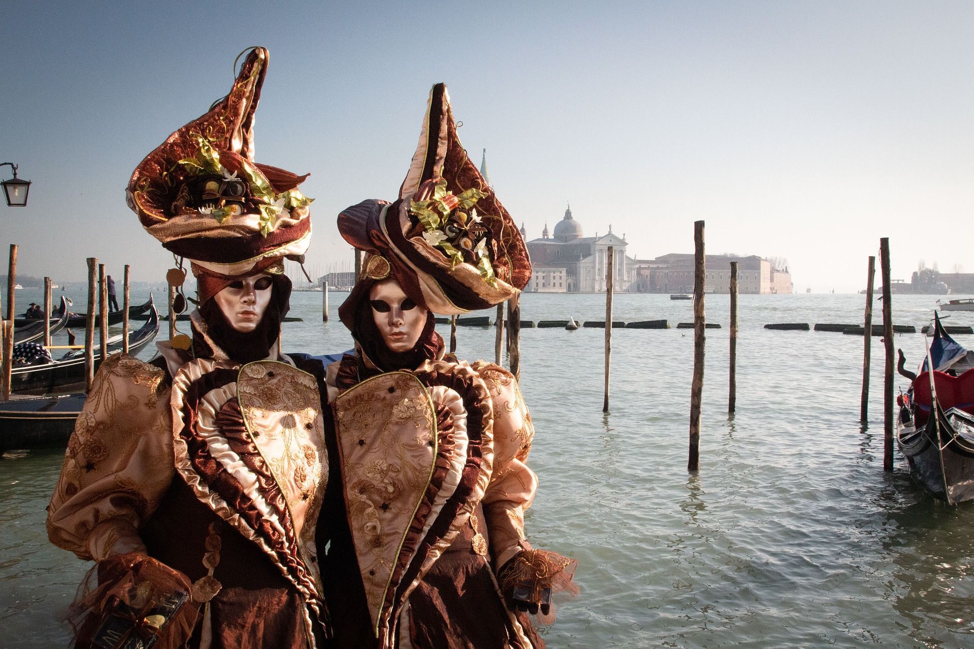 Venice Carnival masks by lagoon