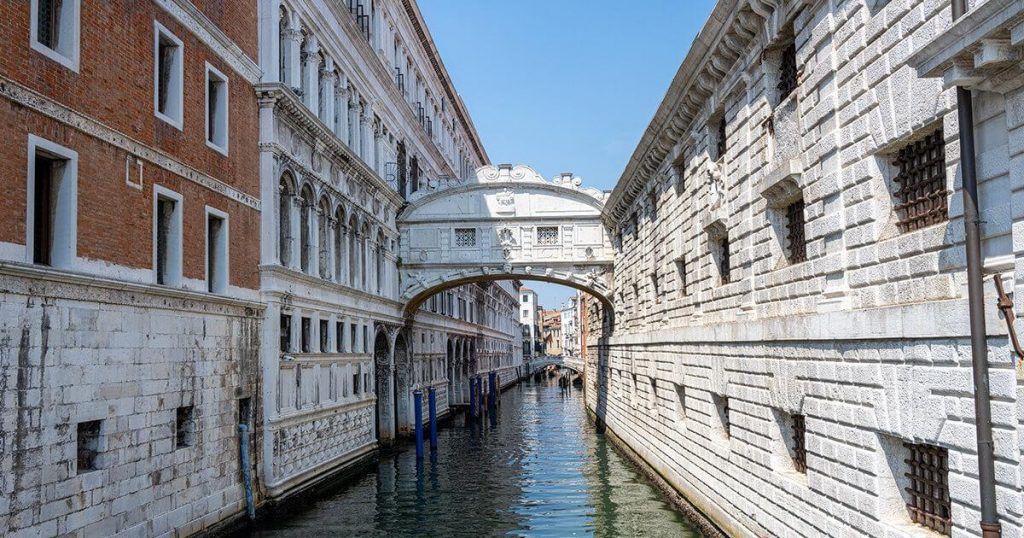 Bridge of Sighs over a Venice canal.