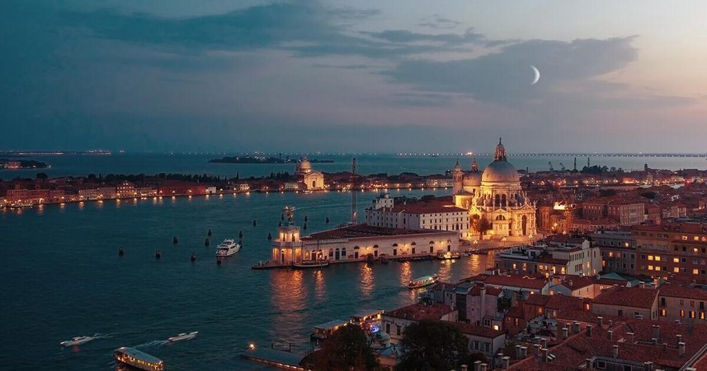Night panorama of Venice lagoon and moon