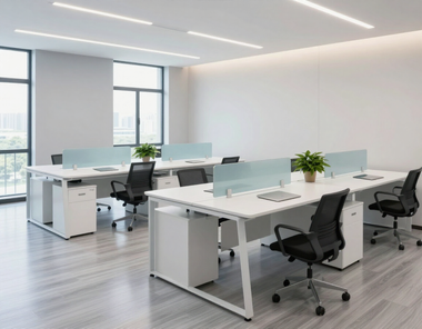 Modern open office with white desks, black chairs, large windows, and bright natural light