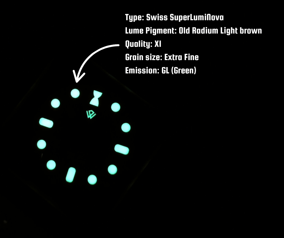 Glowing watch face with light brown lume and green emission details.