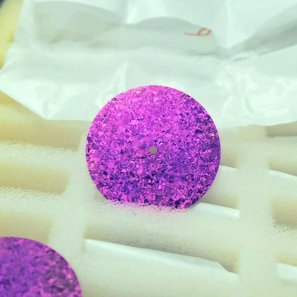 A close up of a purple circle on a white surface