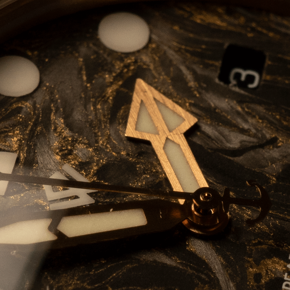 A close up of a watch face with the number 3 on it