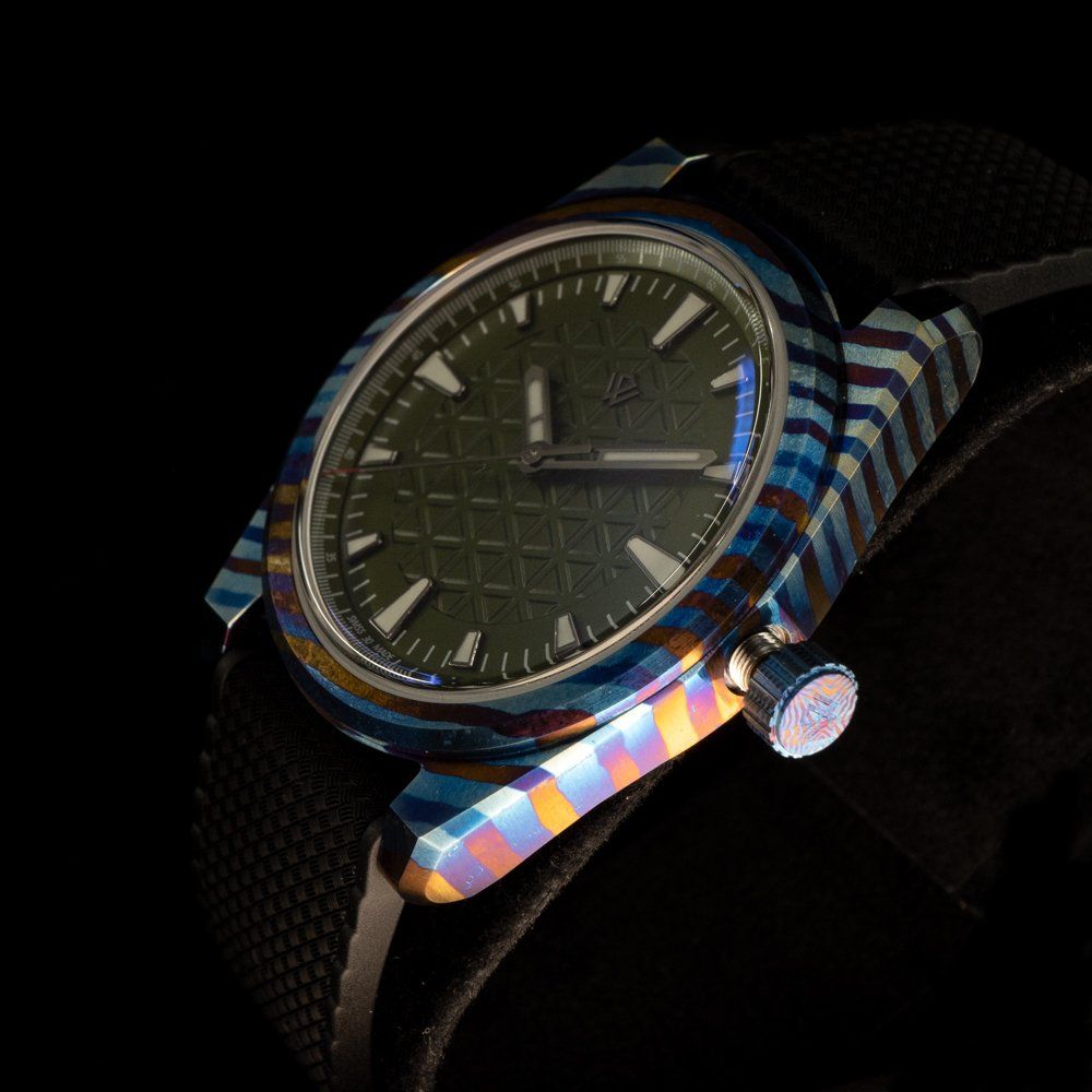 A close up of a watch on a person 's wrist.