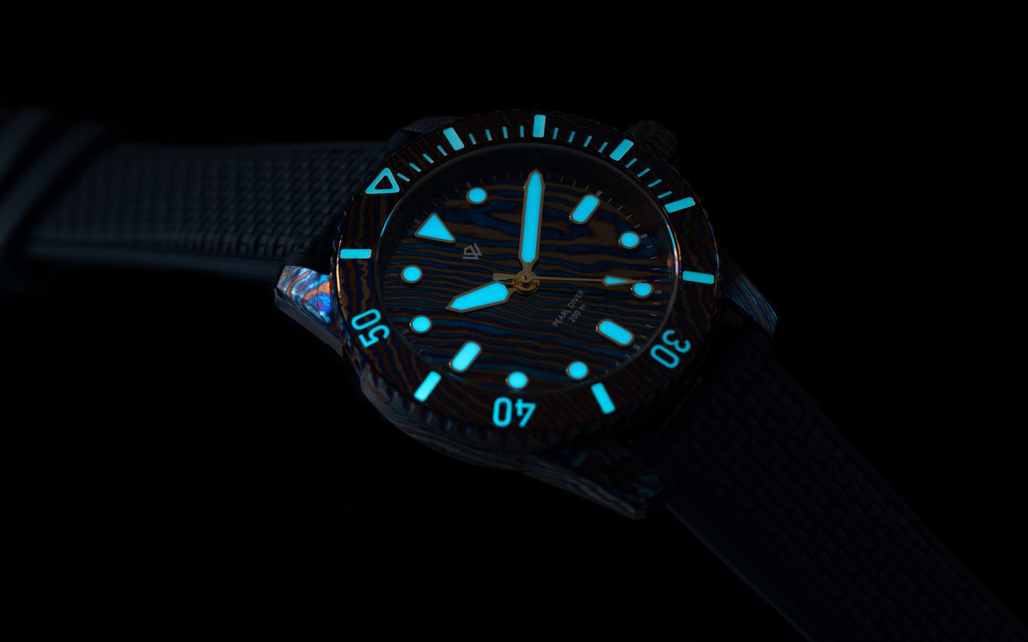 A black wristwatch with luminous blue glowing hands and hour markers against a dark background.