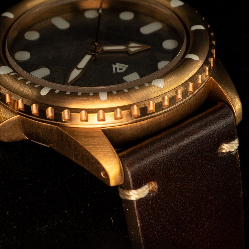 A close up of a watch with the number 14 on the face