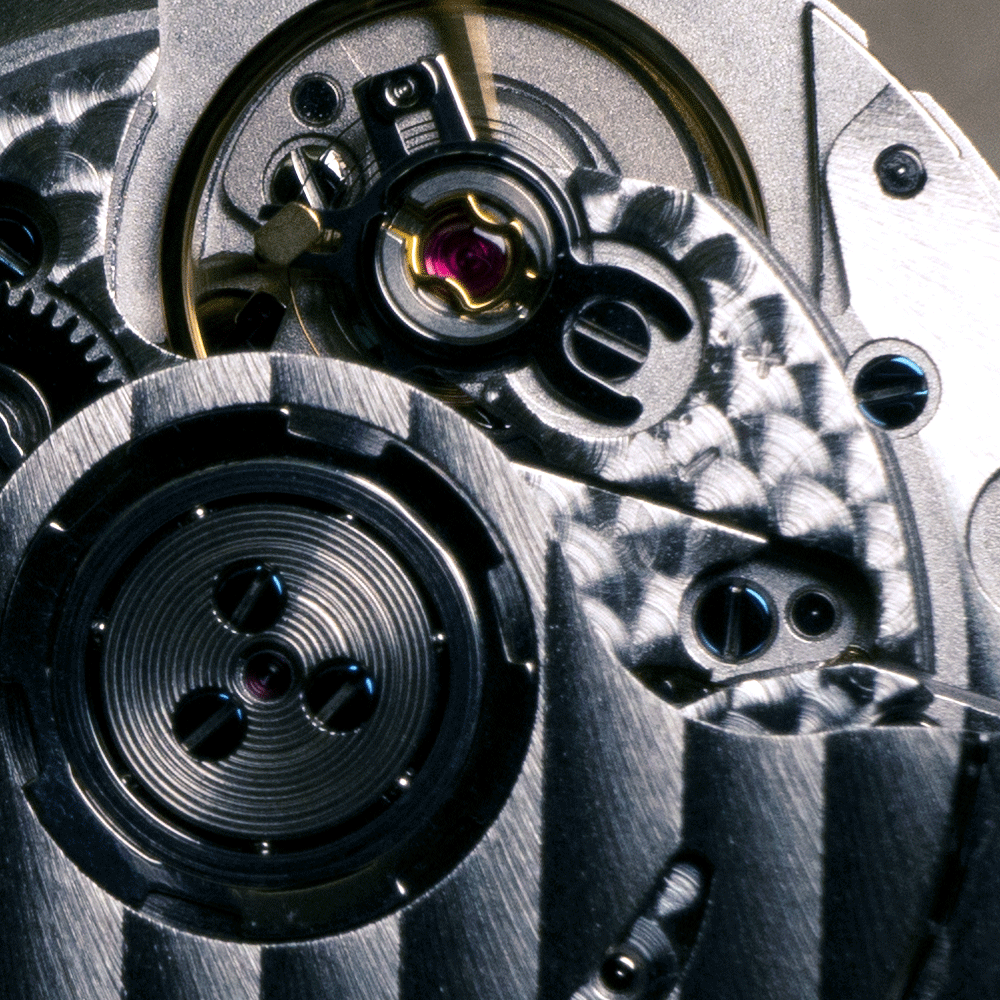 A close up of the inside of a watch mechanism