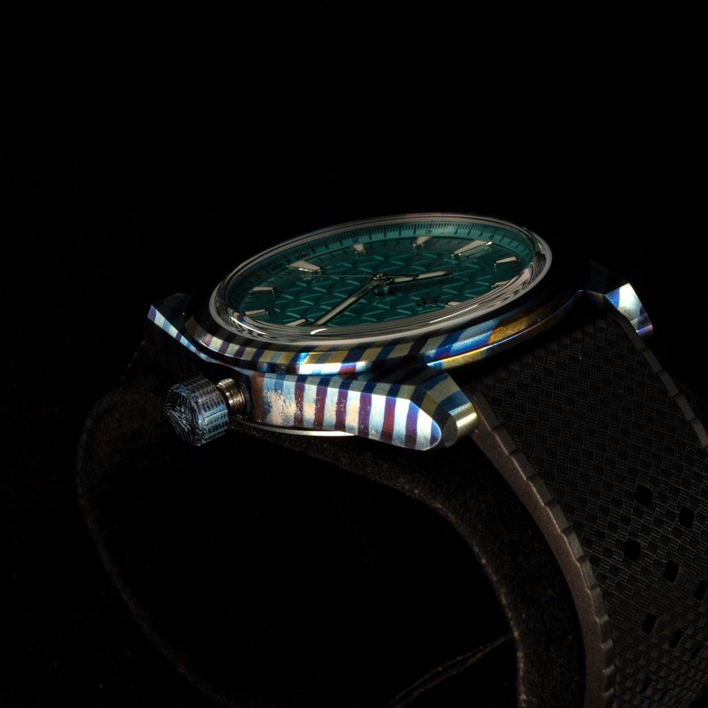 A close up of a watch on a black background