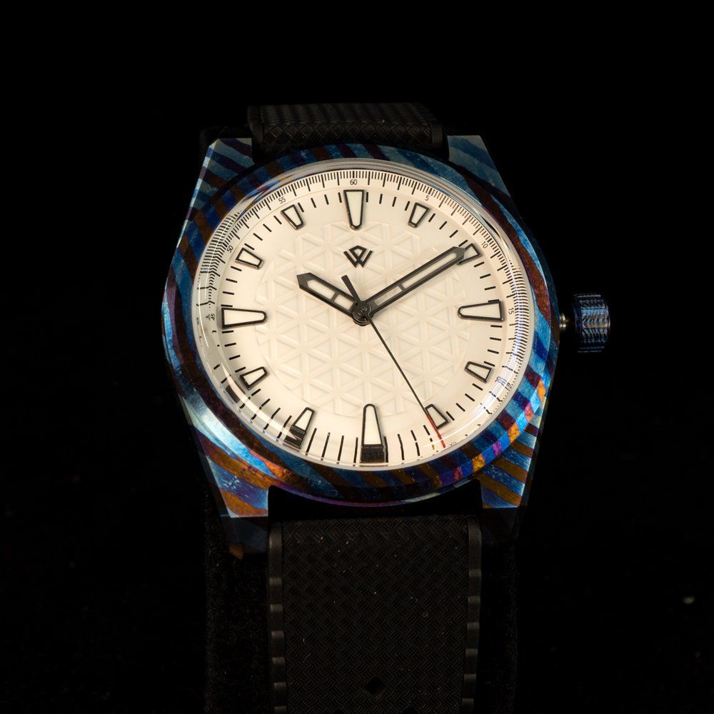 A colorful watch with a black band and a white face