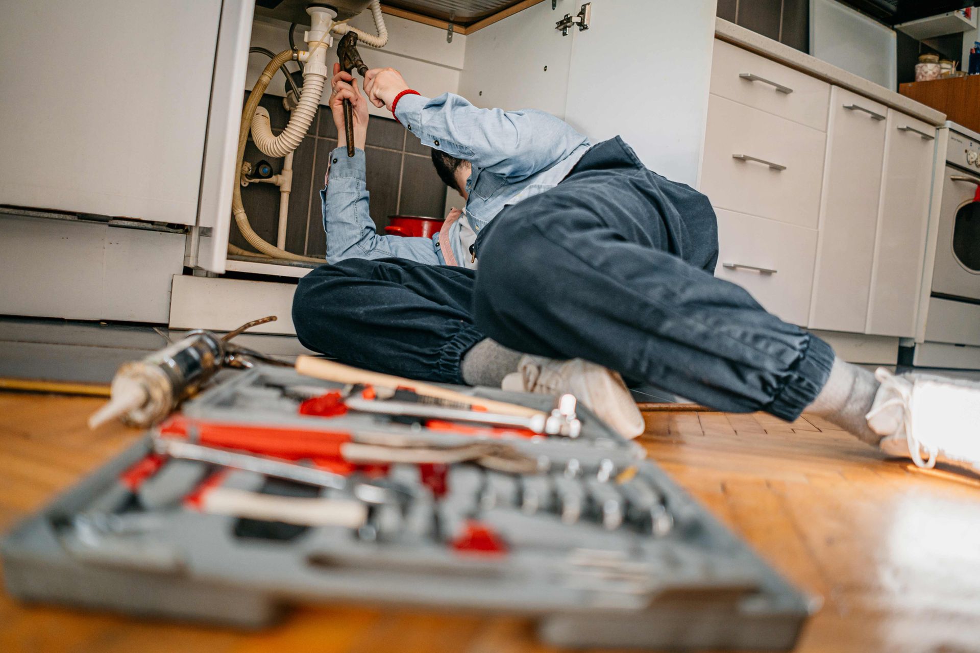 Plumber Fixing a Kitchen Sink — Pittsburg, CA — Expert Plumbing & Rooter