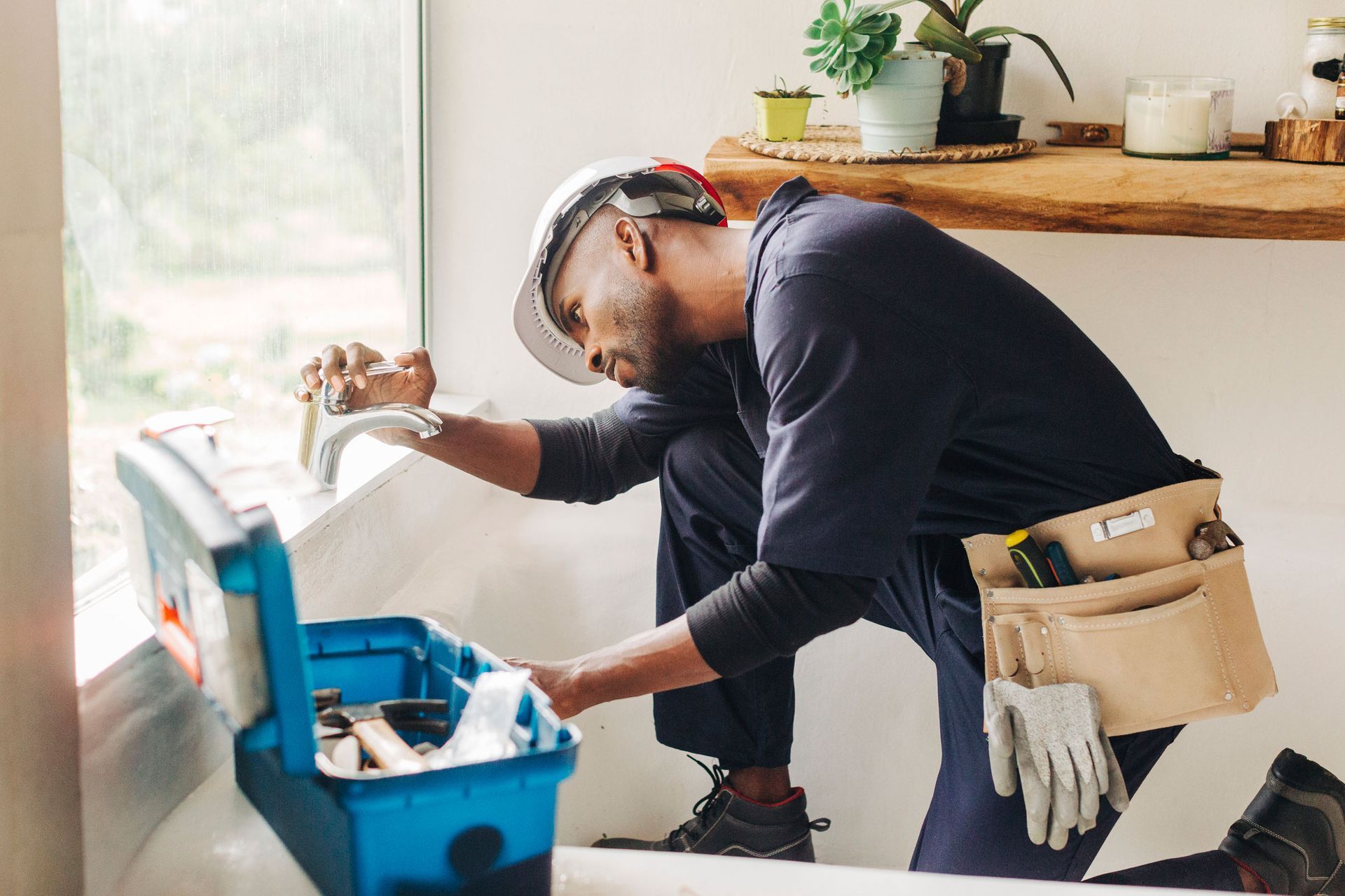 Man Fixing Faucet — Pittsburg, CA — Expert Plumbing & Rooter