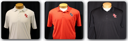Three polo shirts: white, red, and black, each with a BK logo on the chest, displayed on mannequins.