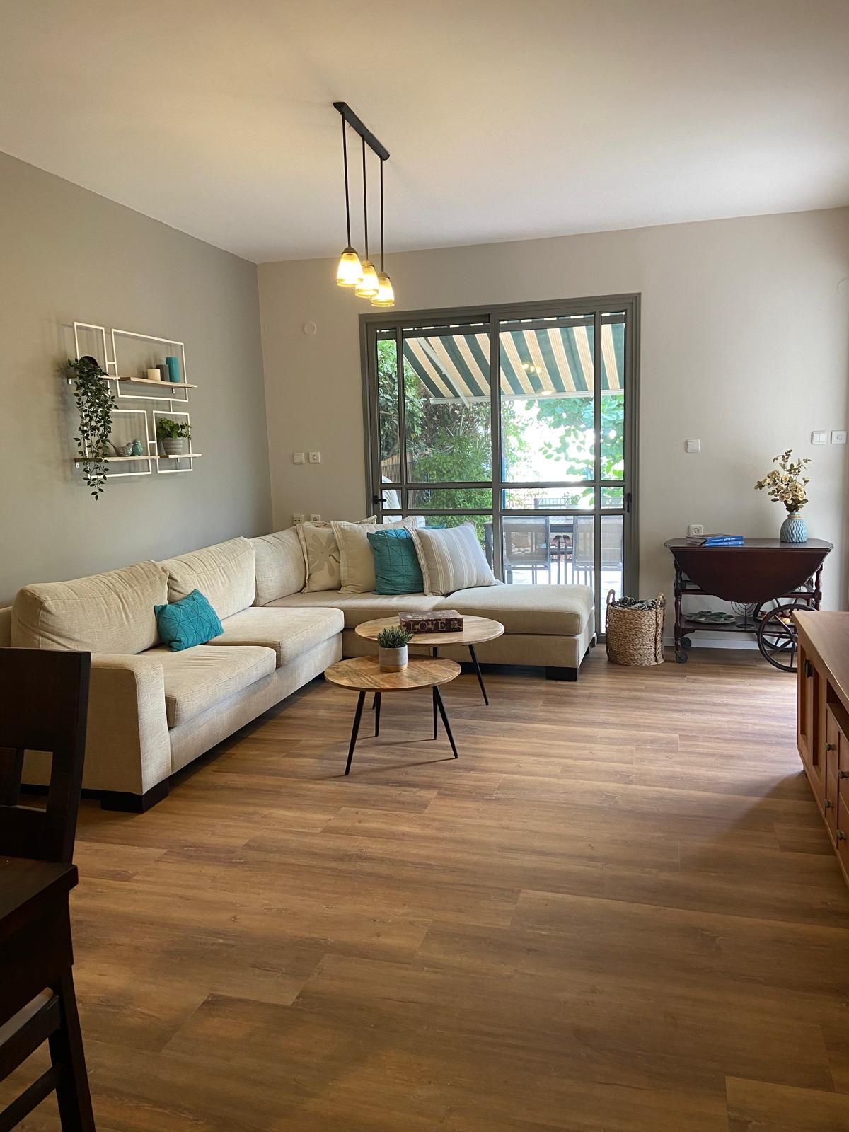 a living room with a couch , table and chairs .