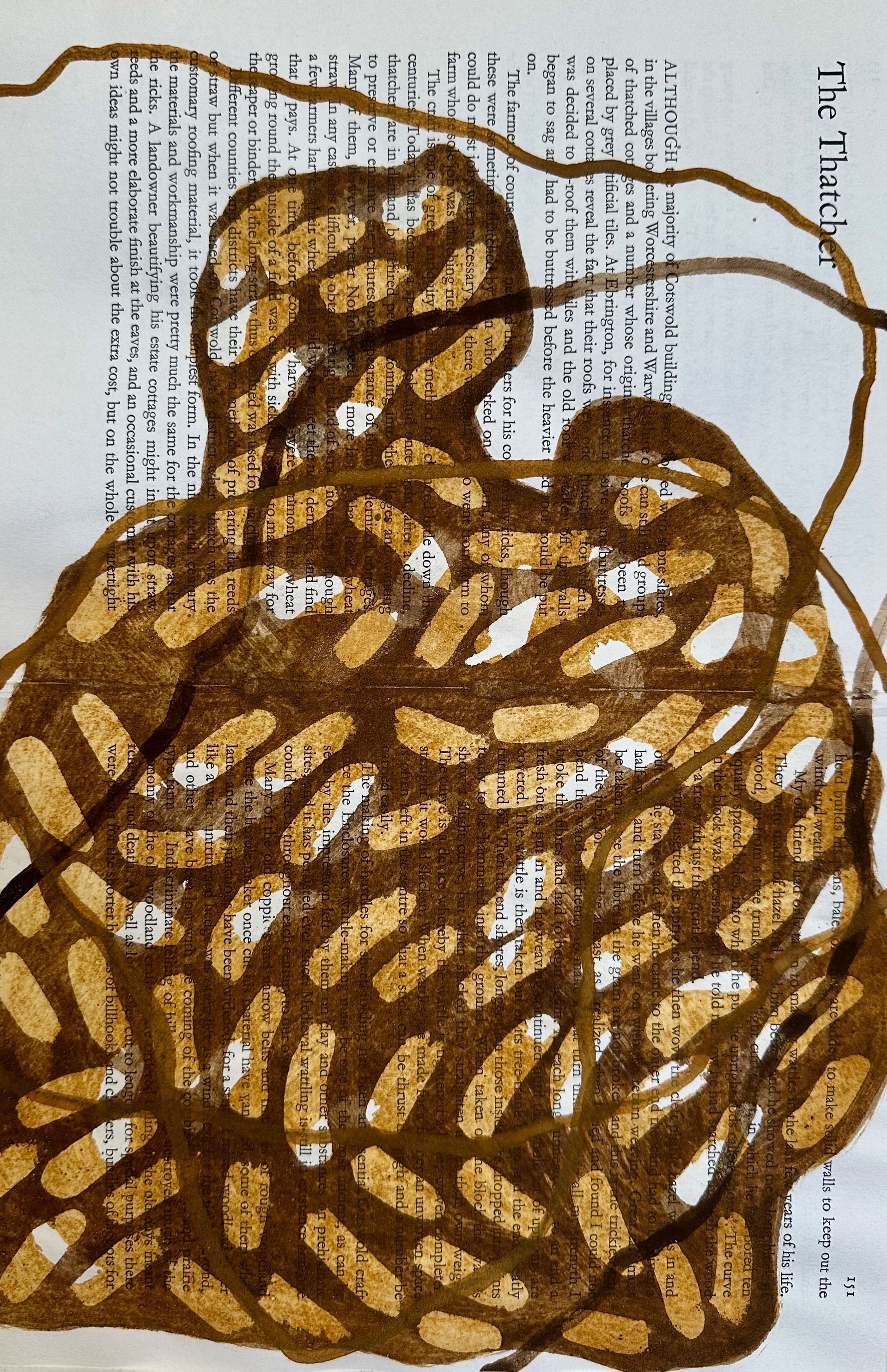Brown woven basket with a loop handle on a printed page