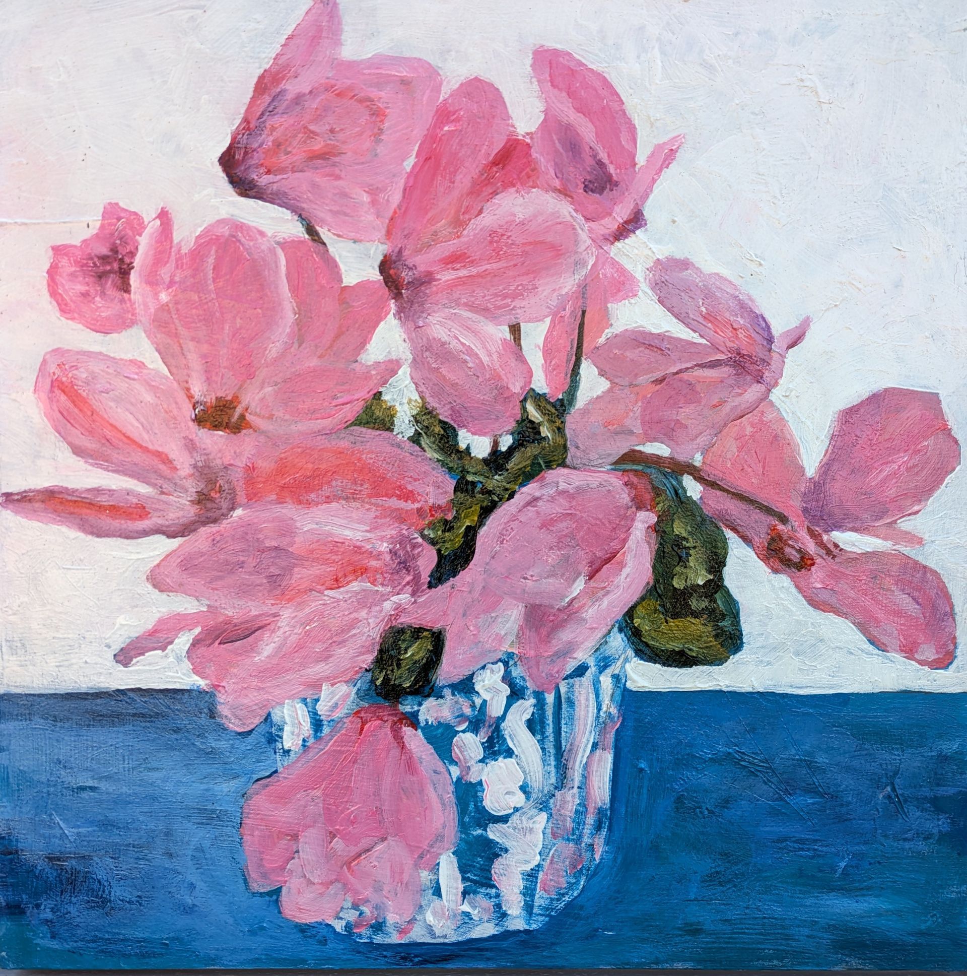 A painting of pink flowers in a blue and white vase