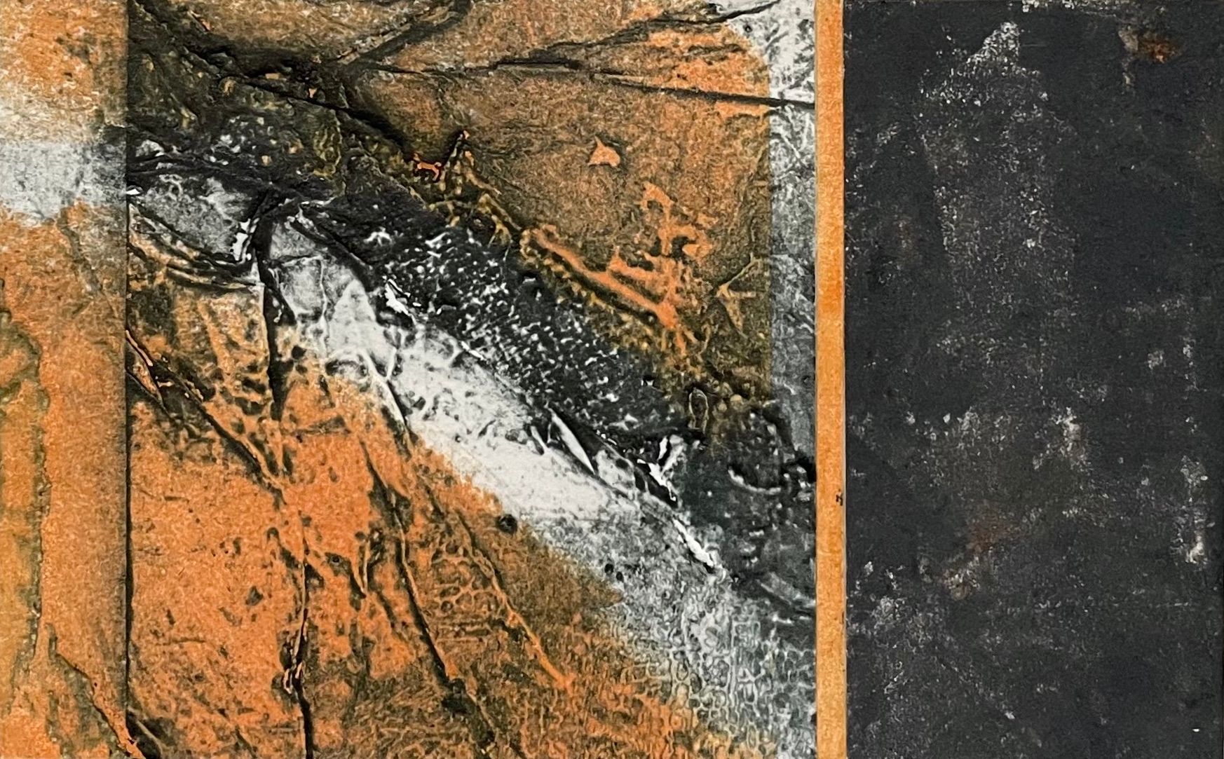 a close up of an orange and black painting