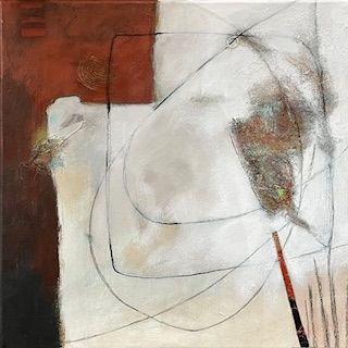 A close up of a painting with a brush on a table.