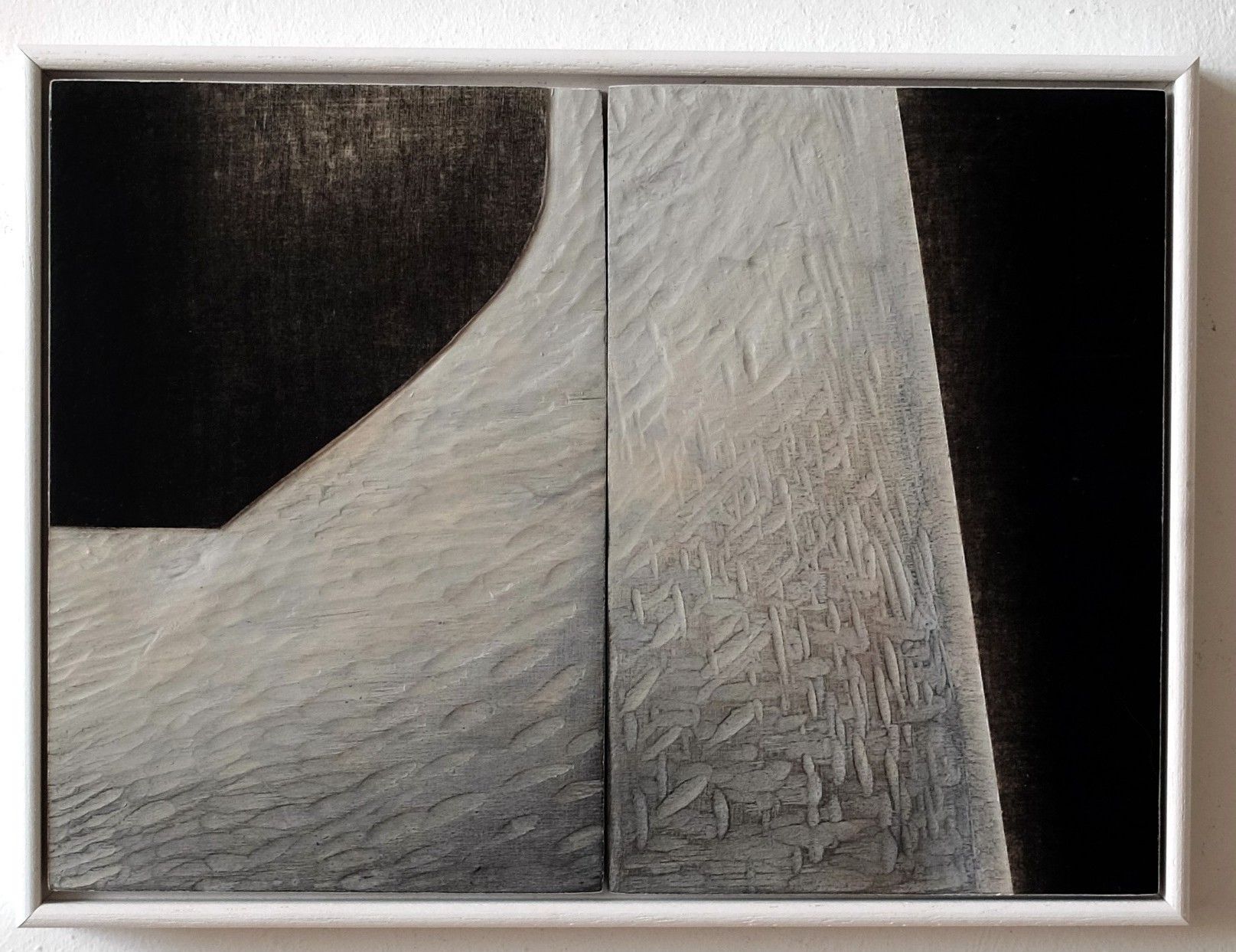 Abstract gray and black textured panels with a curved white shape in the center.