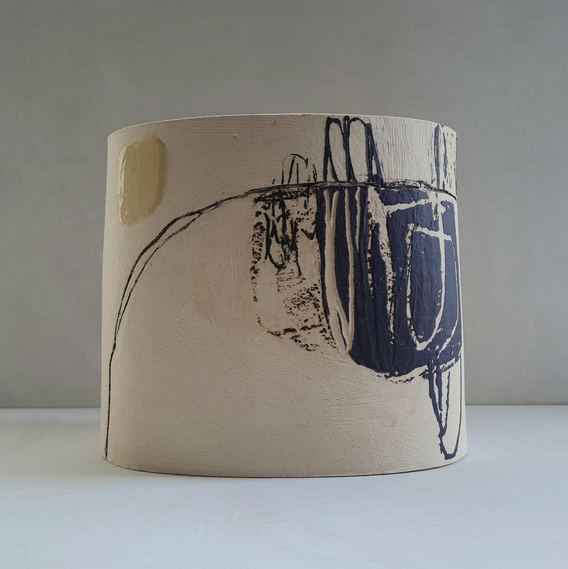 a ceramic vessel with a blue and white design on it
