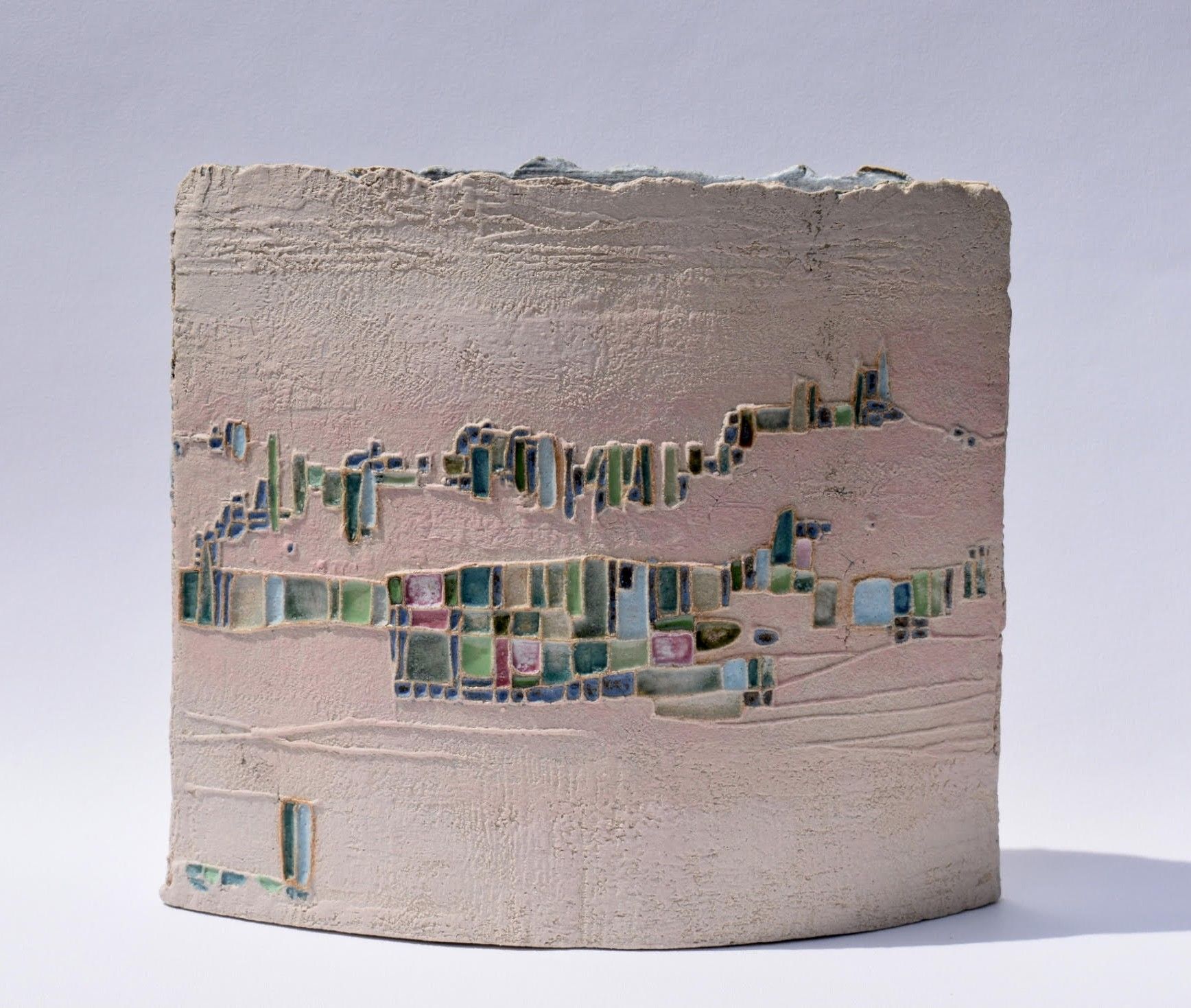 a ceramic vessel with a painting on it