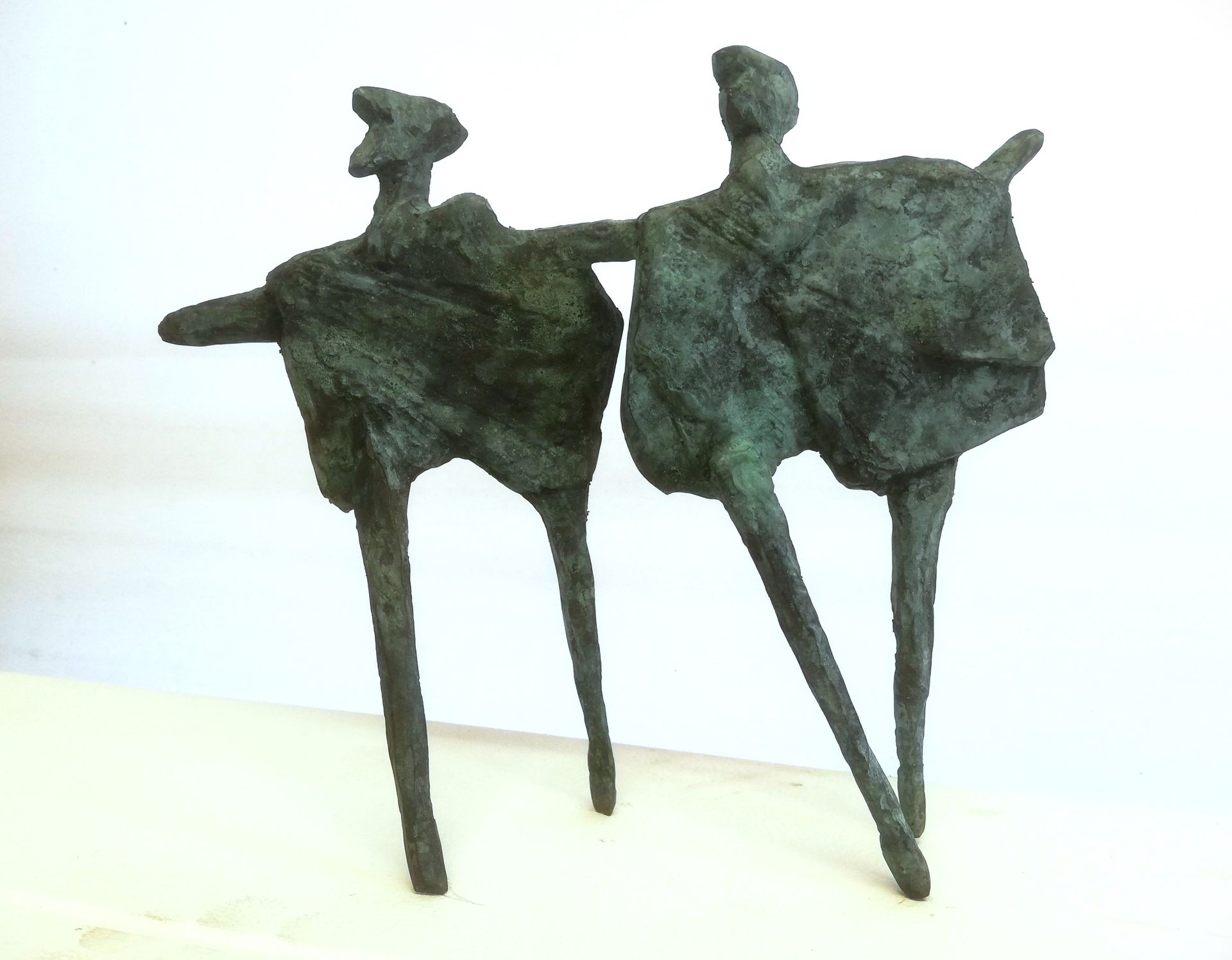 a statue of two people standing next to each other